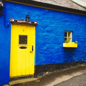 I live in the blue house with the yellow door